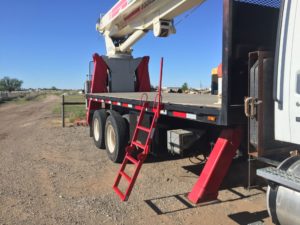 securing loads on a flatbed trailer safely with a flatbed safety ladder